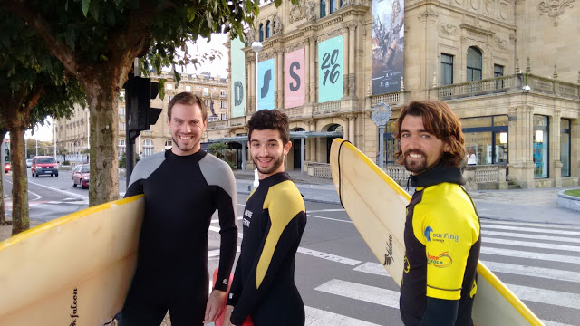 Walking through the streets of San Sebastian, heading for a surf at La Concha beach Walking through the streets of San Sebastian, heading for a surf at La Concha beach